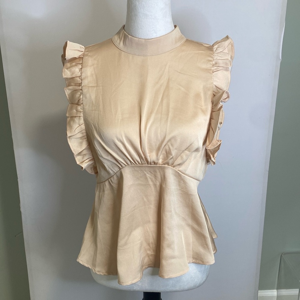 Cream blouse with ruffle details